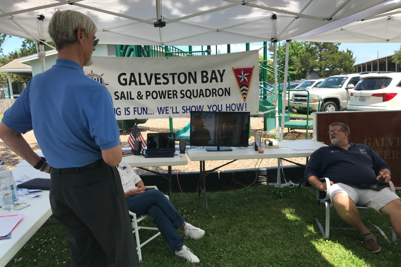 Galveston Bay Sail and Power Squadron volunteers staffing an outreach booth.
